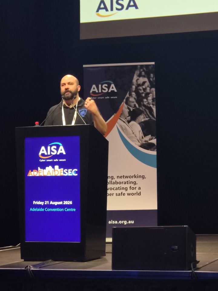 Seth Enoka delivering an AdelaideSec conference presentation