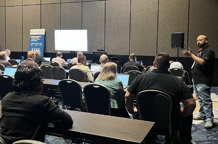 Seth Enoka teaching a SANS GIAC workshop in a classroom at The Star Gold Coast